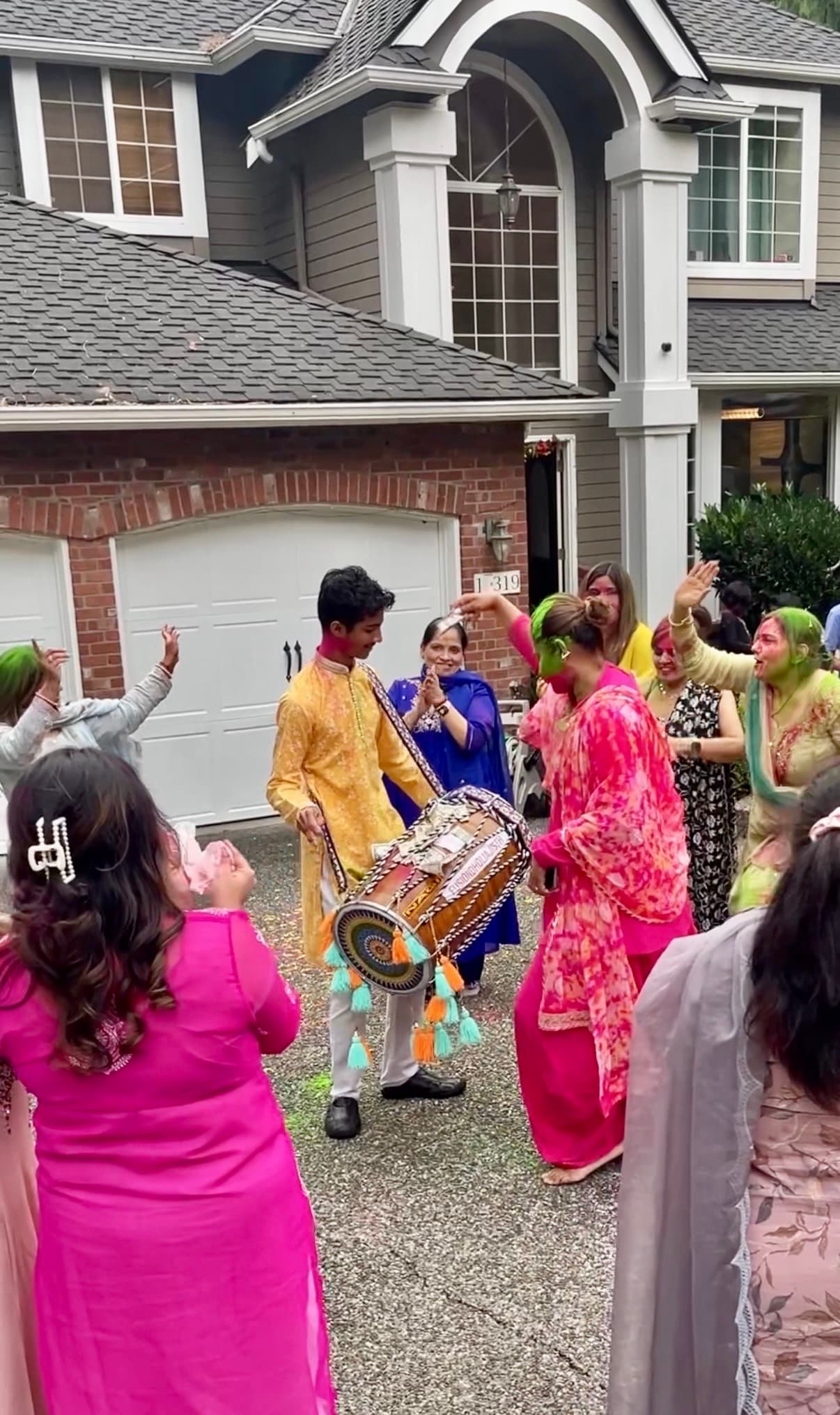 Ajisth performing dhol at a wedding