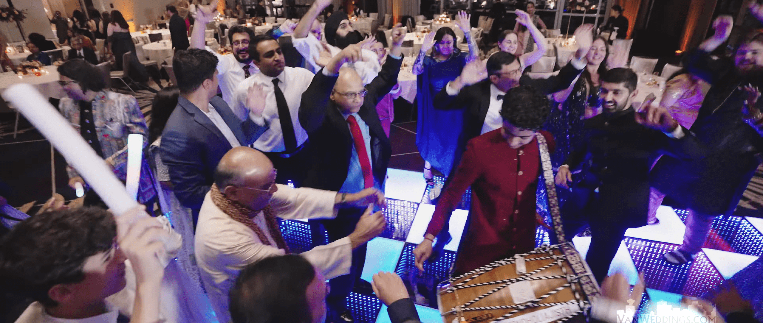 Ajisth performing dhol at an outdoor event